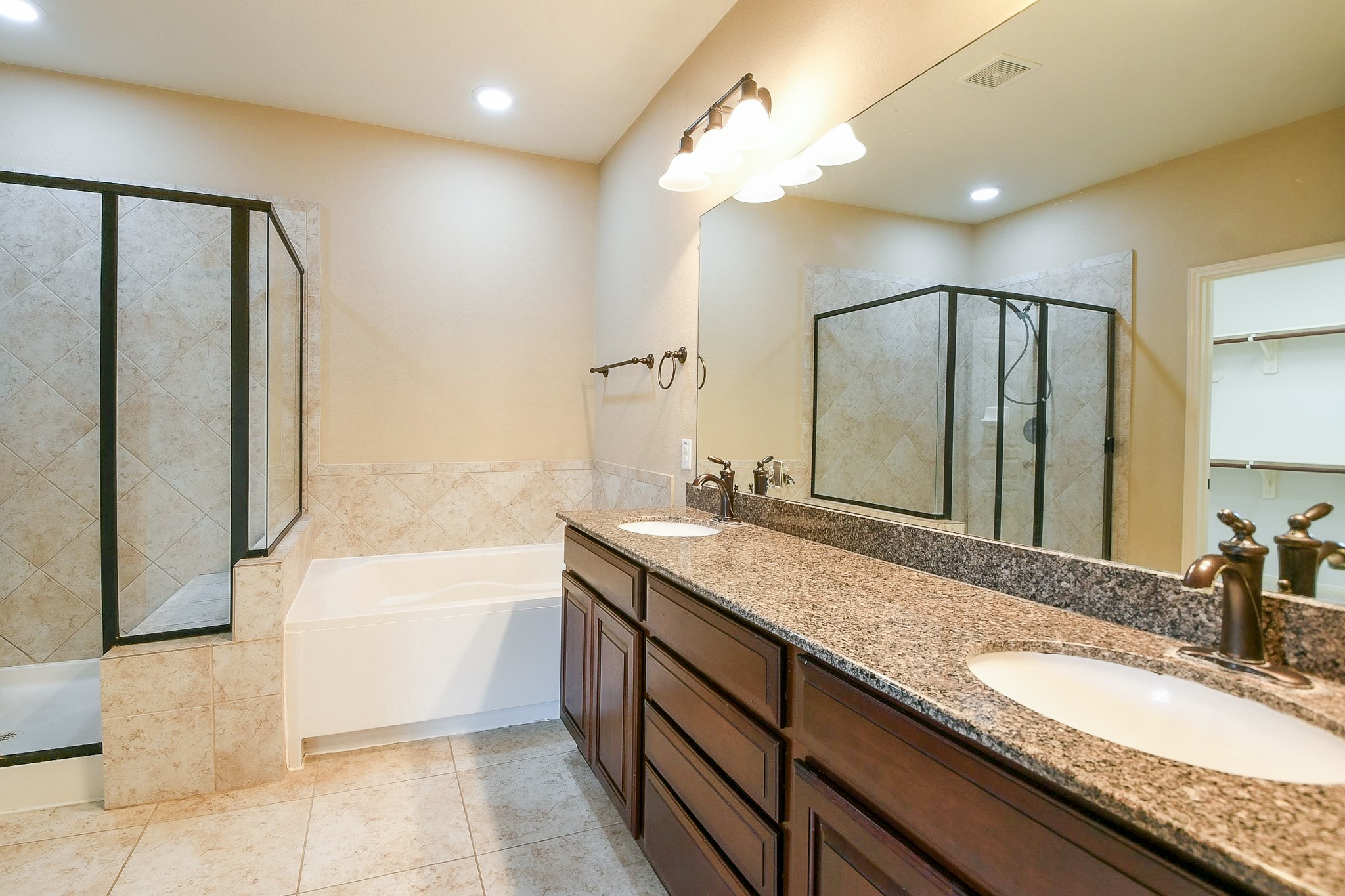 1619 Ralston Branch Way Sugar Land, TX 77479 - Photo 13 of 20 a bathroom with a granite countertop sink mirror and a bath tub
