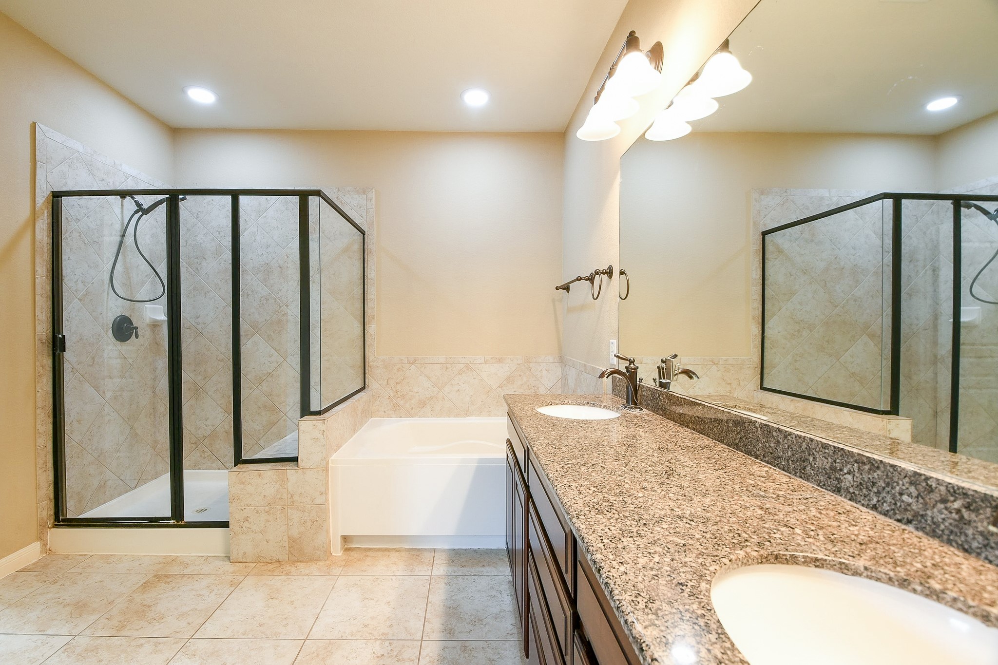 1619 Ralston Branch Way Sugar Land, TX 77479 - Photo 14 of 20 a bathroom with a granite countertop sink a mirror and shower
