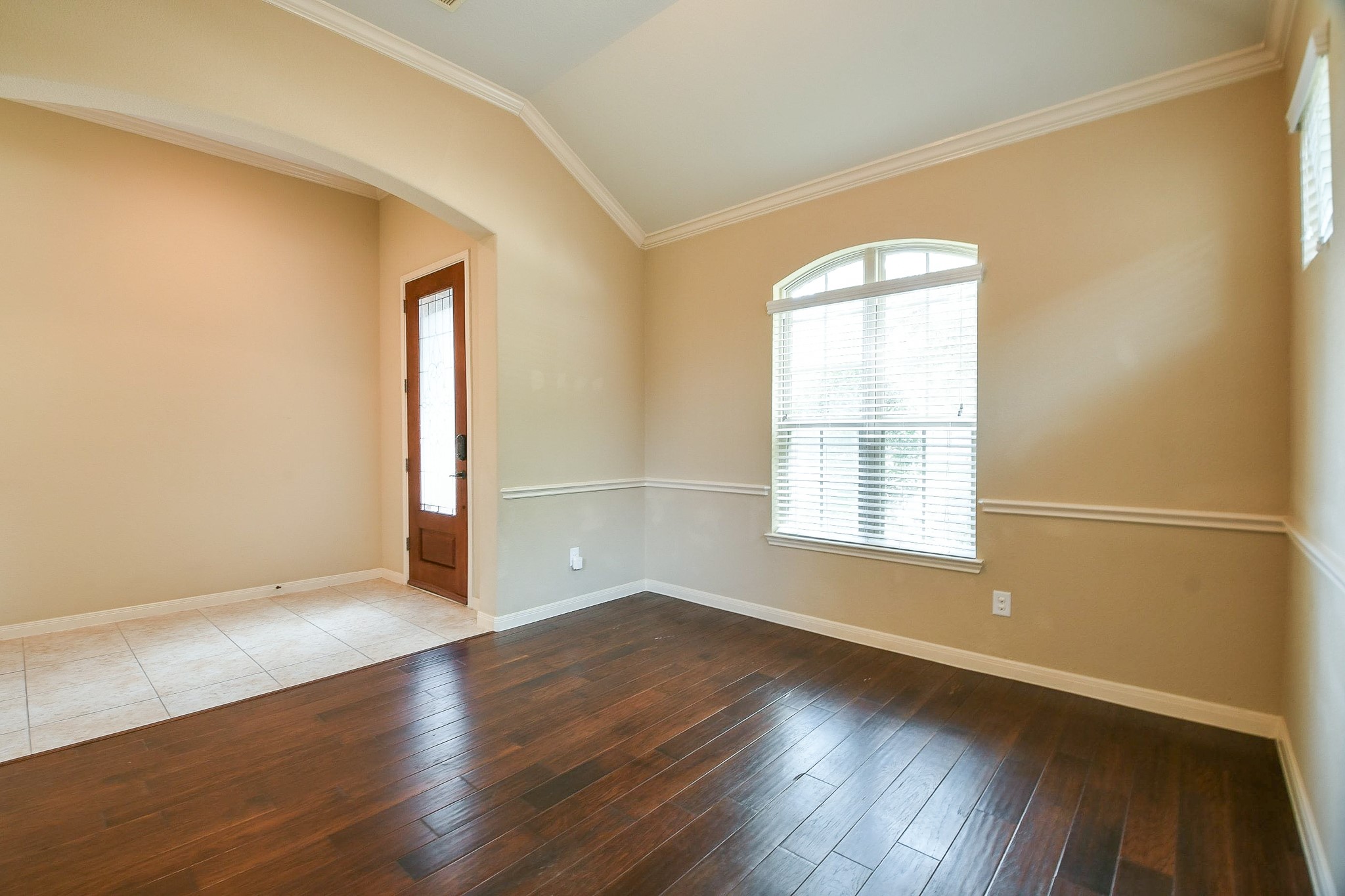 1619 Ralston Branch Way Sugar Land, TX 77479 - Photo 3 of 20 an empty room with wooden floor and windows