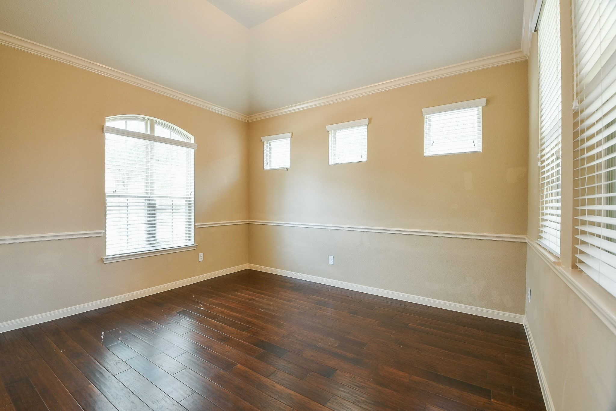 1619 Ralston Branch Way Sugar Land, TX 77479 - Photo 4 of 20 an empty room with wooden floor and windows