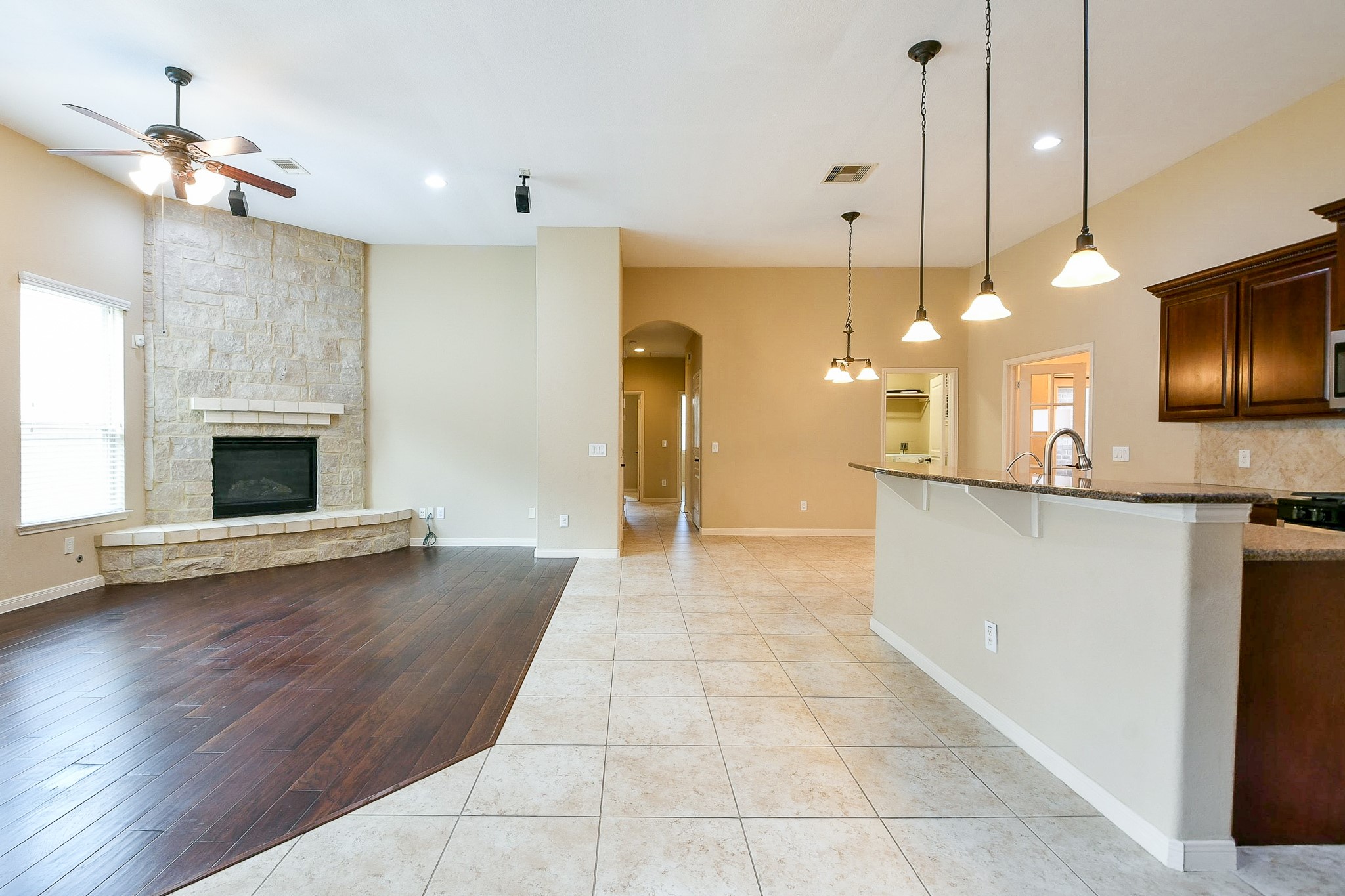 1619 Ralston Branch Way Sugar Land, TX 77479 - Photo 5 of 20 a view of a kitchen with a sink fire place and a refrigerator