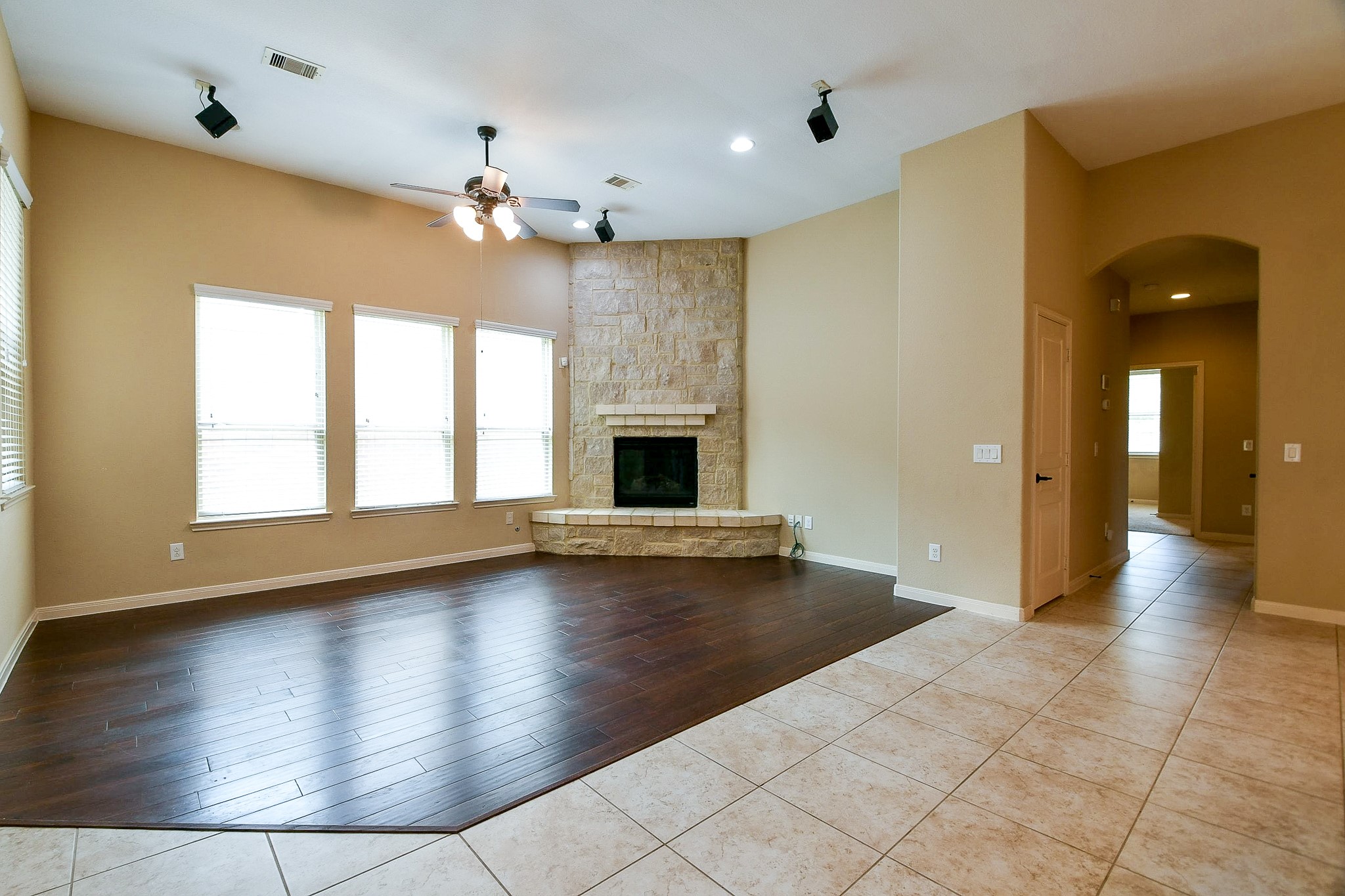 1619 Ralston Branch Way Sugar Land, TX 77479 - Photo 9 of 20 a view of a livingroom with a ceiling fan window and wooden floor