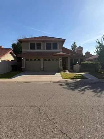 a view of house with basketball court