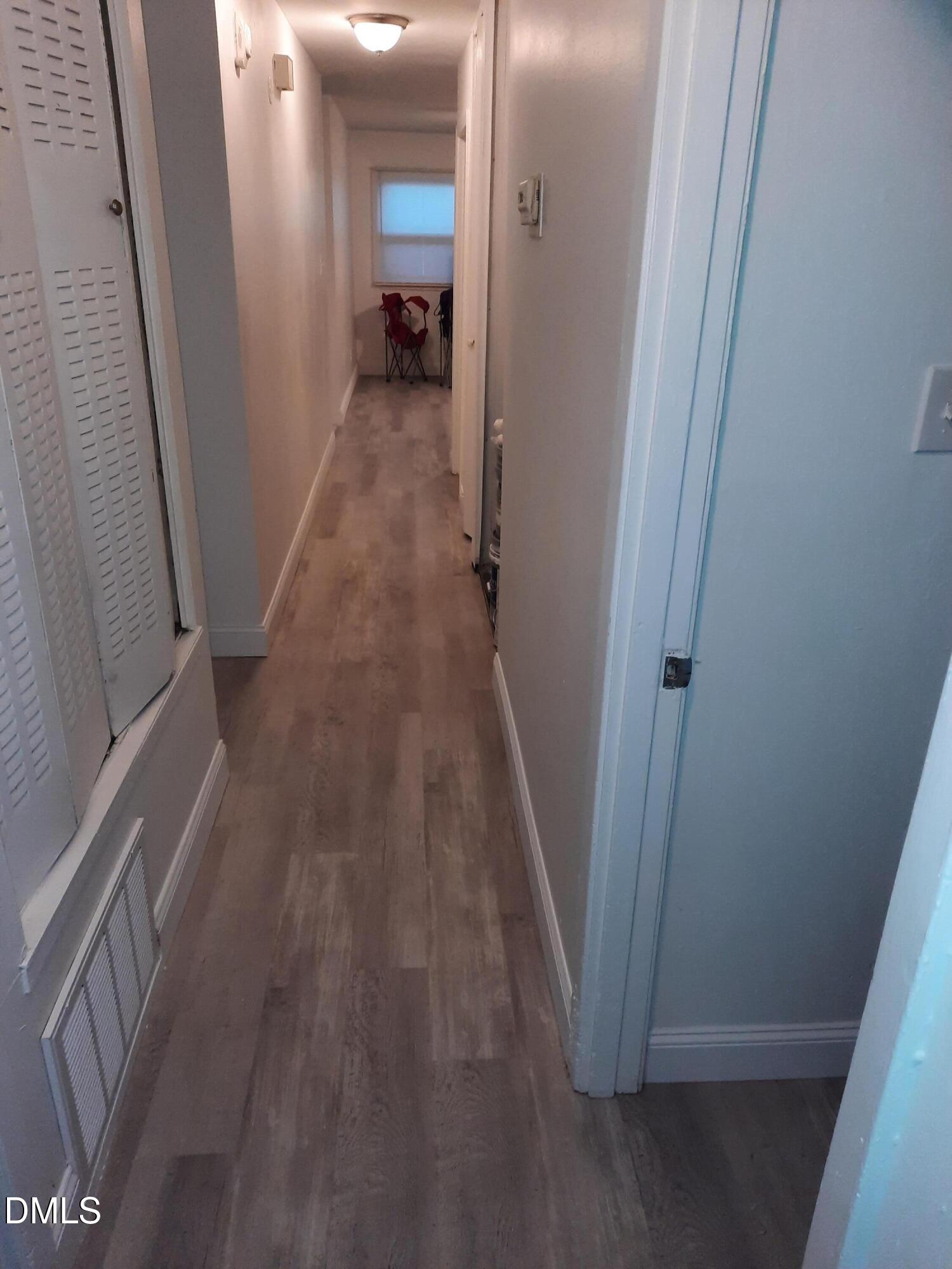 404 Lynn Road Durham, NC 27703 - Photo 3 of 5 a view of a hallway and a livingroom with furniture