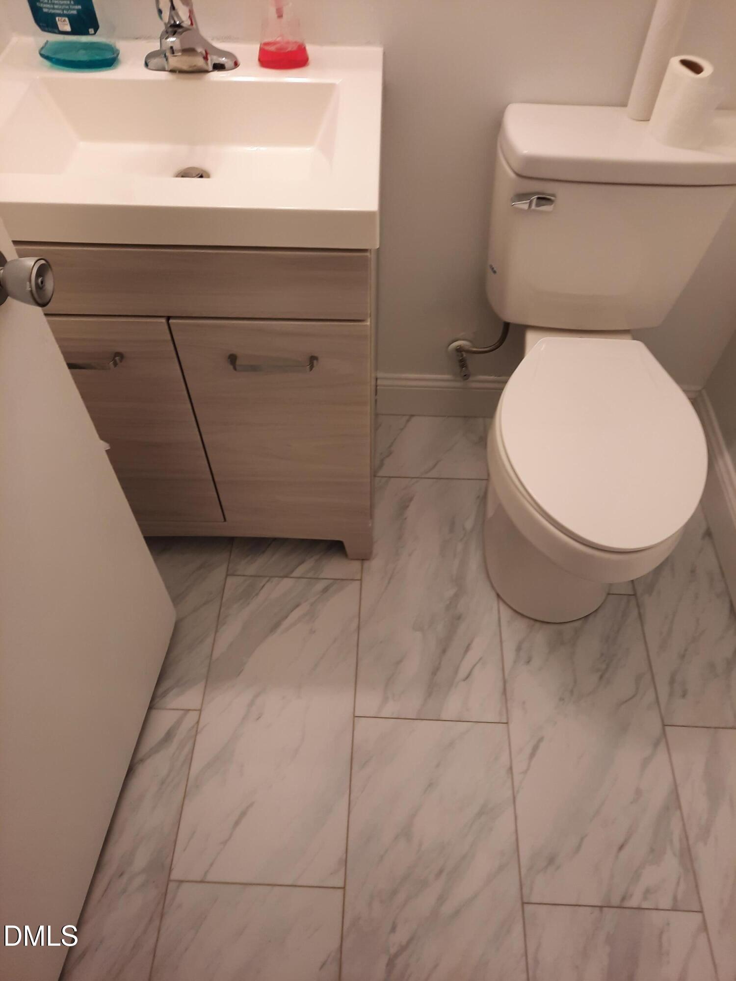 404 Lynn Road Durham, NC 27703 - Photo 5 of 5 a close view of a toilet in a bathroom