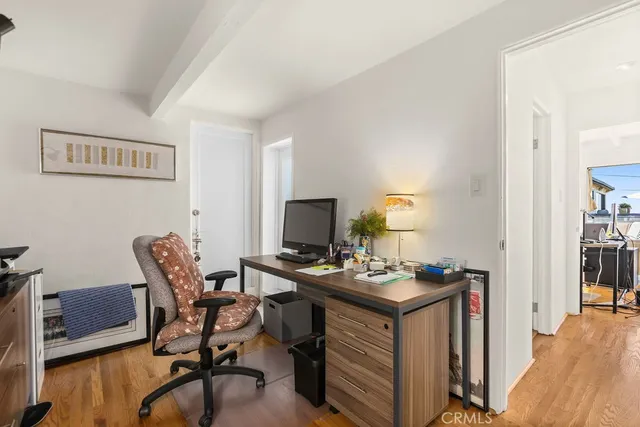 a workspace with furniture and wooden floor