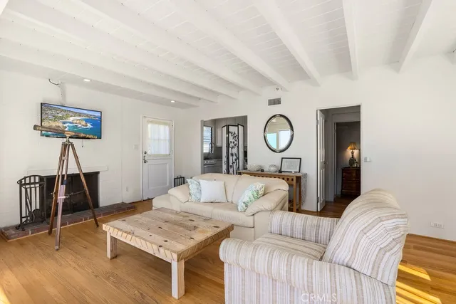 a living room with furniture a desk and chair