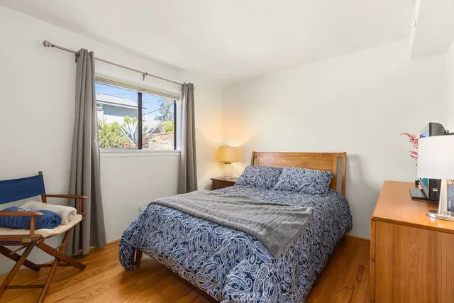 a bedroom with a bed and a table in it