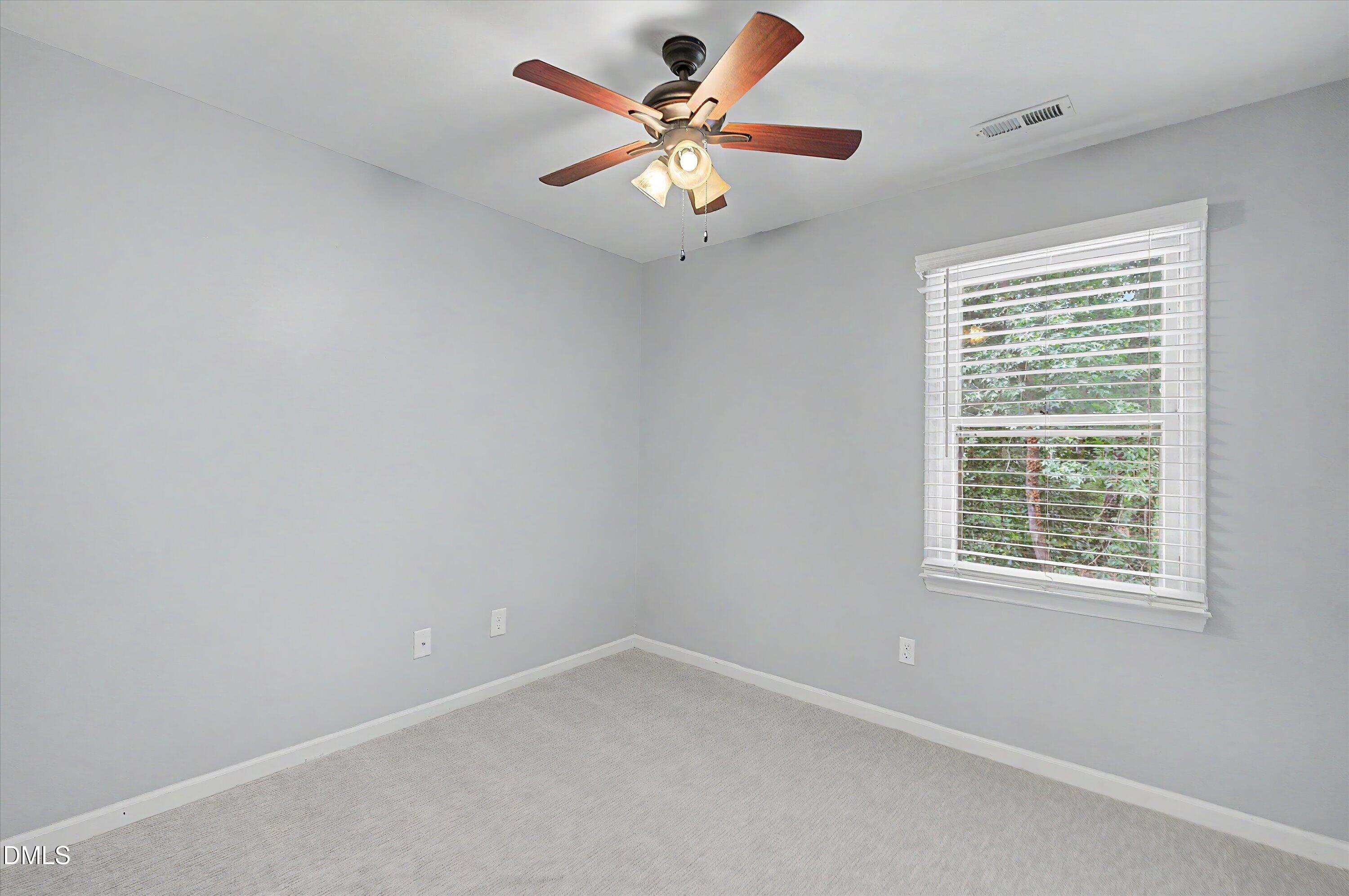 5519 Hamstead Crossing Raleigh, NC 27612 - Photo 27 of 33 a view of an empty room with a window