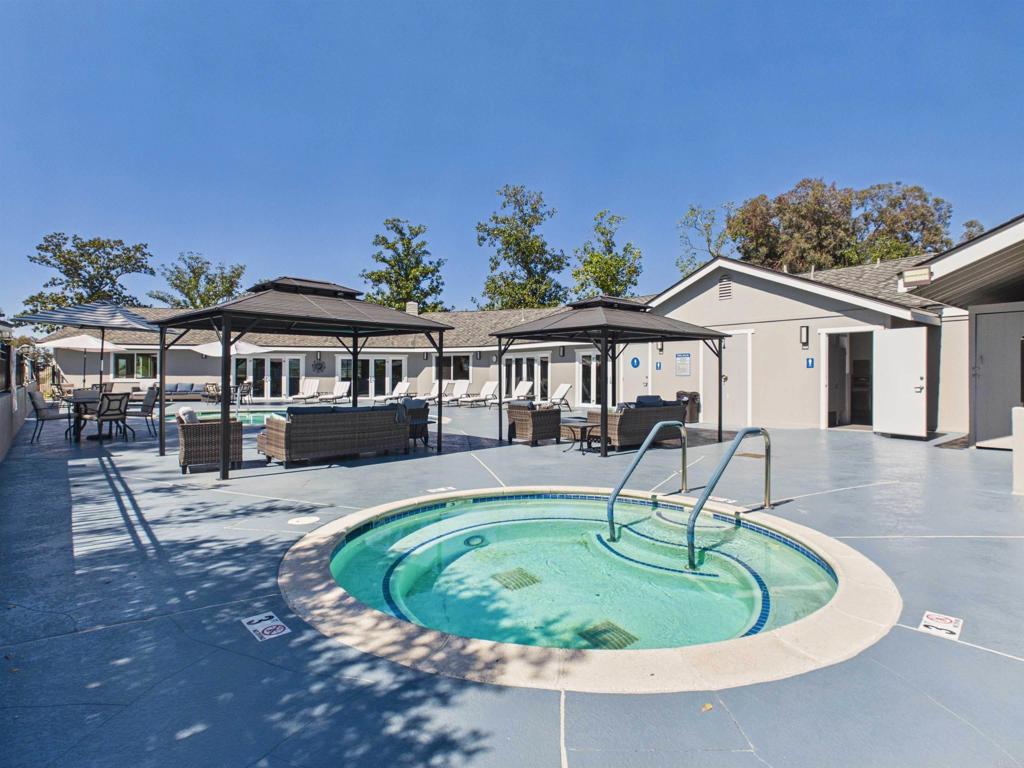 18218 Paradise Mountain Road, Unit 220 Valley Center, CA 92082 - Photo 12 of 48 a front view of a house with a garden