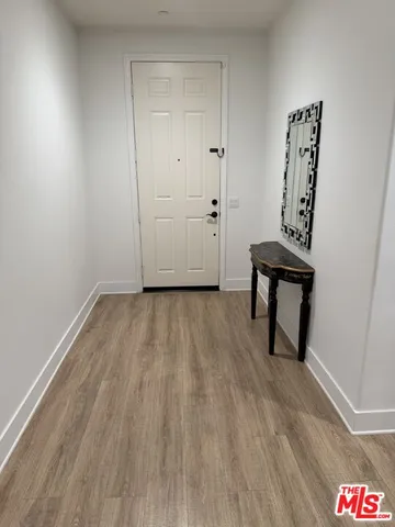 a view of room with hardwood floor