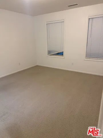 an empty room with a bench