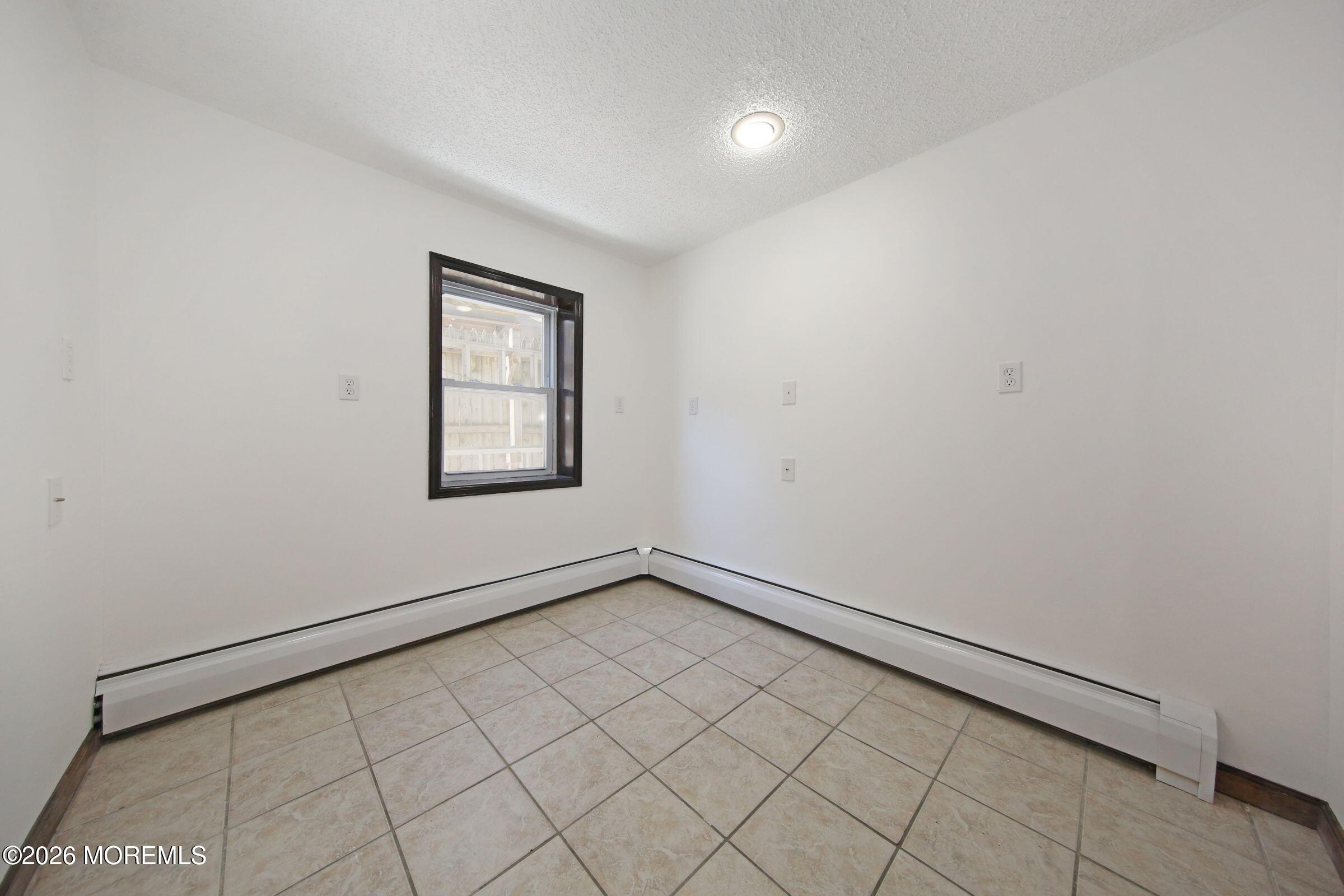 60 Matthew Street, Unit 1 Highlands, NJ 07732 - Photo 21 of 33 an empty room with windows
