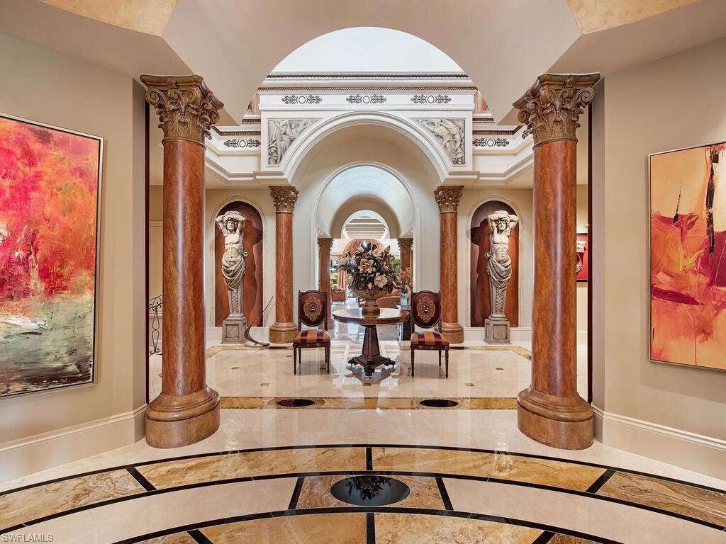 3133 Rum Row Naples, FL 34102 - Photo 14 of 35 a view of living room with fireplace with furniture