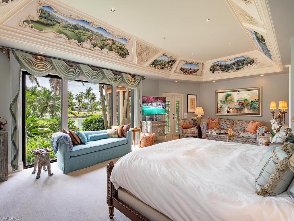 3133 Rum Row Naples, FL 34102 - Photo 25 of 35 a large bedroom with furniture and a large window