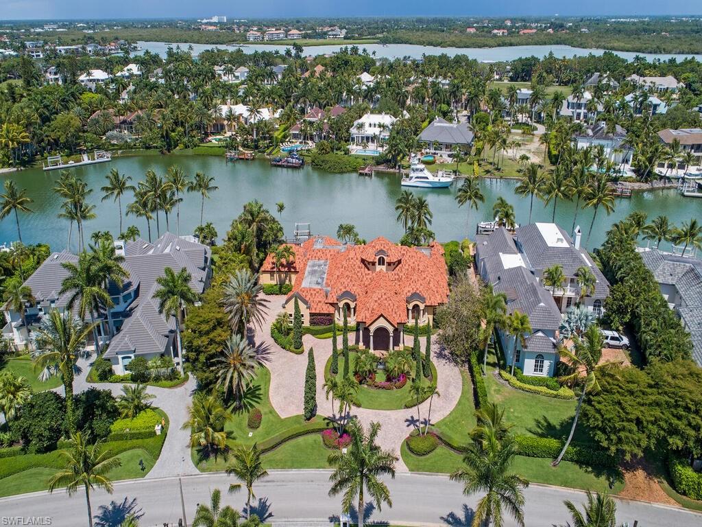 3133 Rum Row Naples, FL 34102 - Photo 3 of 35 an aerial view of residential houses with outdoor space