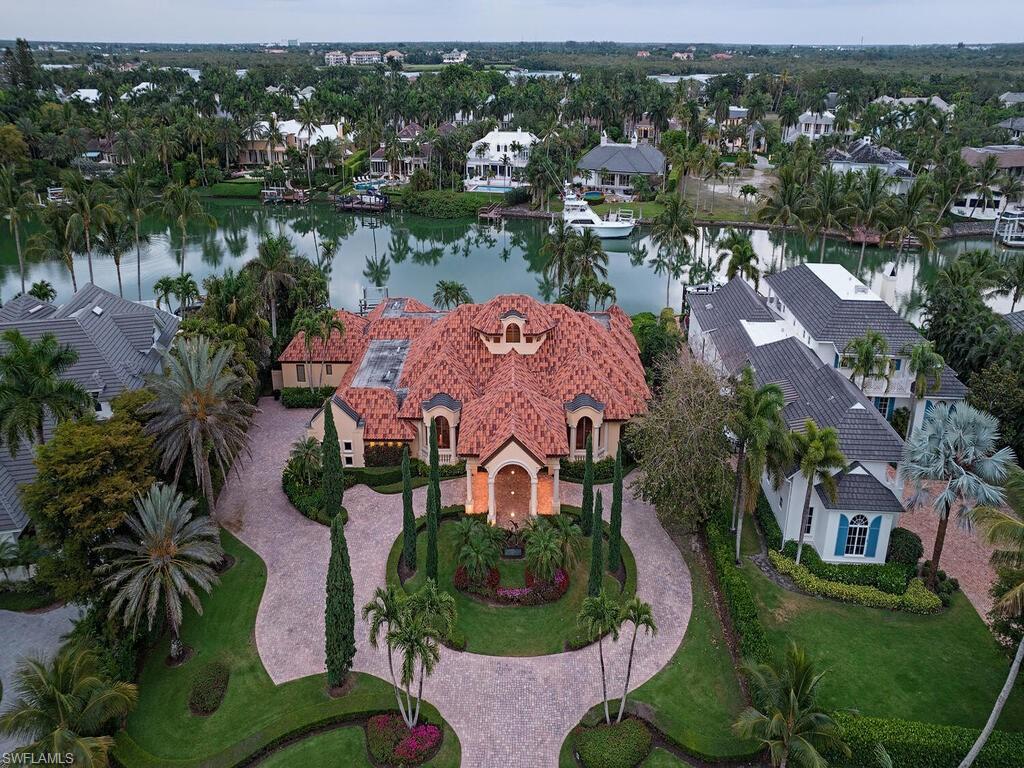 3133 Rum Row Naples, FL 34102 - Photo 32 of 35 an aerial view of a house with yard
