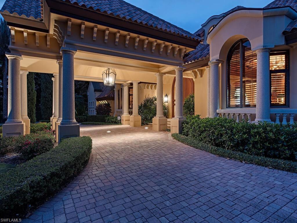 3133 Rum Row Naples, FL 34102 - Photo 34 of 35 a view of a building with potted plants