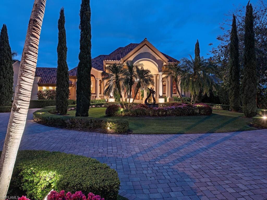 3133 Rum Row Naples, FL 34102 - Photo 4 of 35 a view of a park with a pathway and a yard