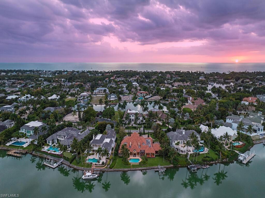 3133 Rum Row Naples, FL 34102 - Photo 5 of 35 an aerial view of residential house with outdoor space and lake view