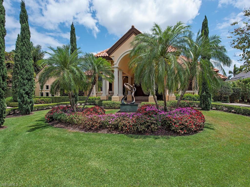 3133 Rum Row Naples, FL 34102 - Photo 7 of 35 a view of a garden with palm trees