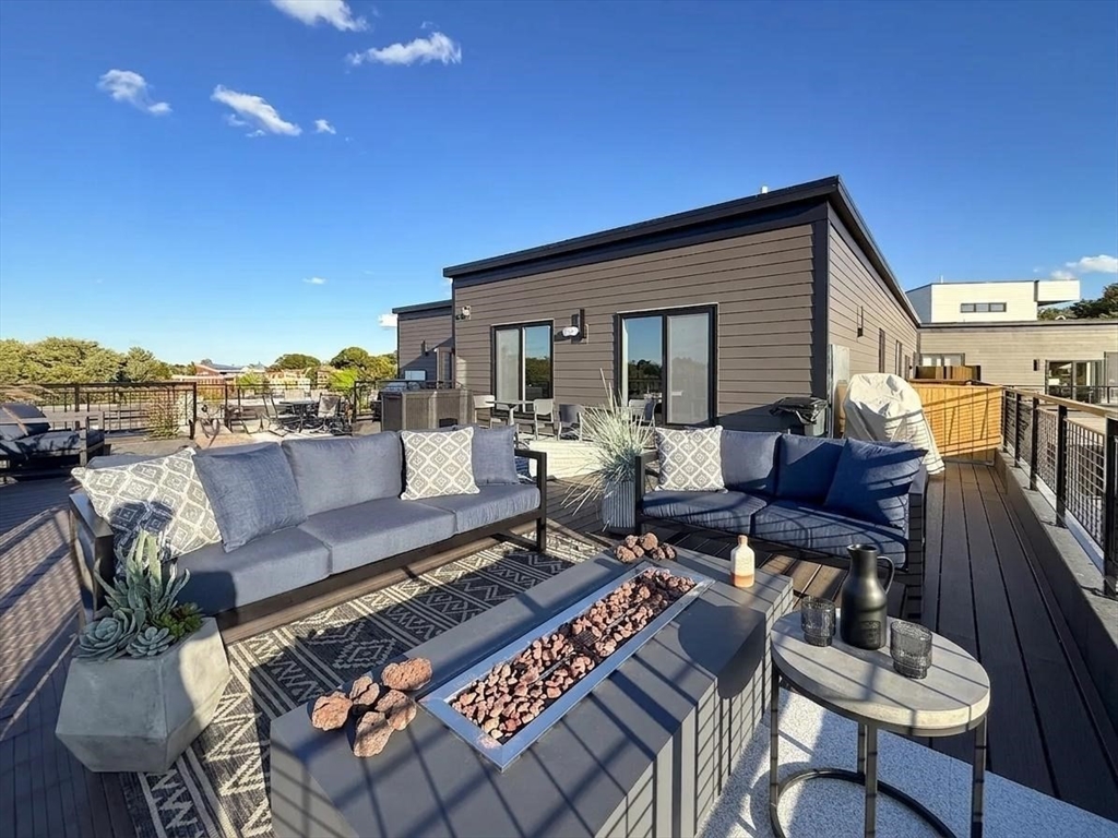 500 Talbot Avenue, Unit 403 Boston, MA 02124 - Photo 14 of 25 a outdoor living space with furniture and city view