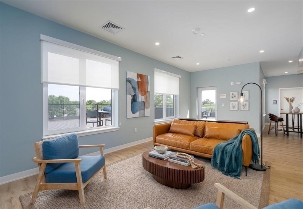 500 Talbot Avenue, Unit 403 Boston, MA 02124 - Photo 23 of 25 a living room with furniture and a large window