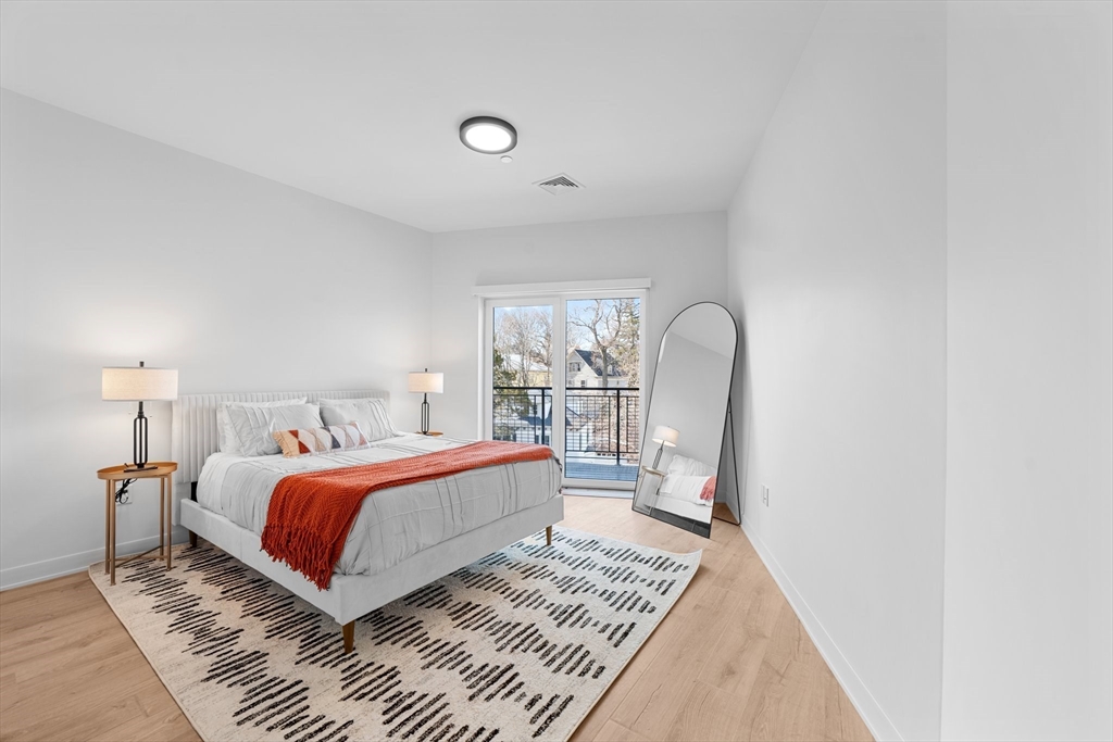 500 Talbot Avenue, Unit 403 Boston, MA 02124 - Photo 3 of 25 a bedroom with bed and a window