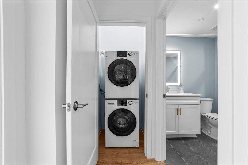 500 Talbot Avenue, Unit 403 Boston, MA 02124 - Photo 8 of 25 a view of a hallway with washer and dryer