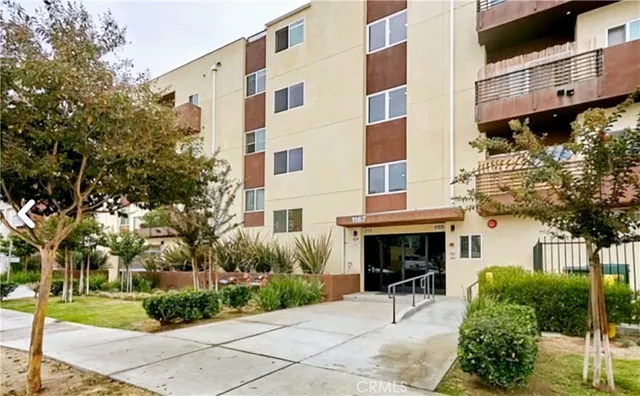 a view of a building with a yard