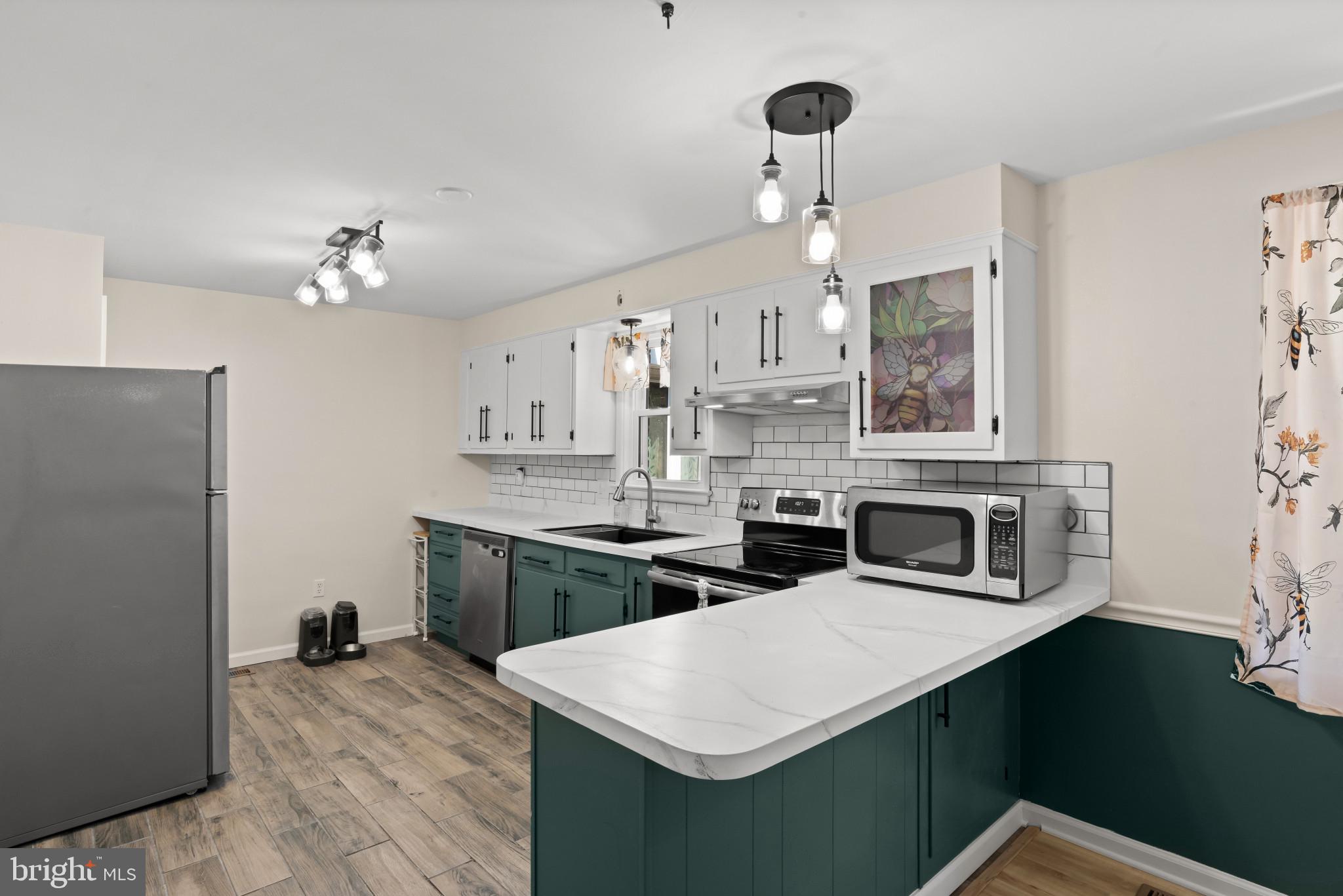14 Sharon Road Enola, PA 17025 - Photo 11 of 40 Kitchen featuring two-tone cabinetry with white up