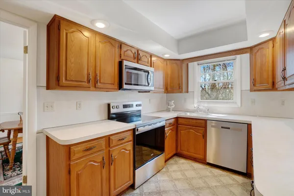 a kitchen with a refrigerator and cabinets