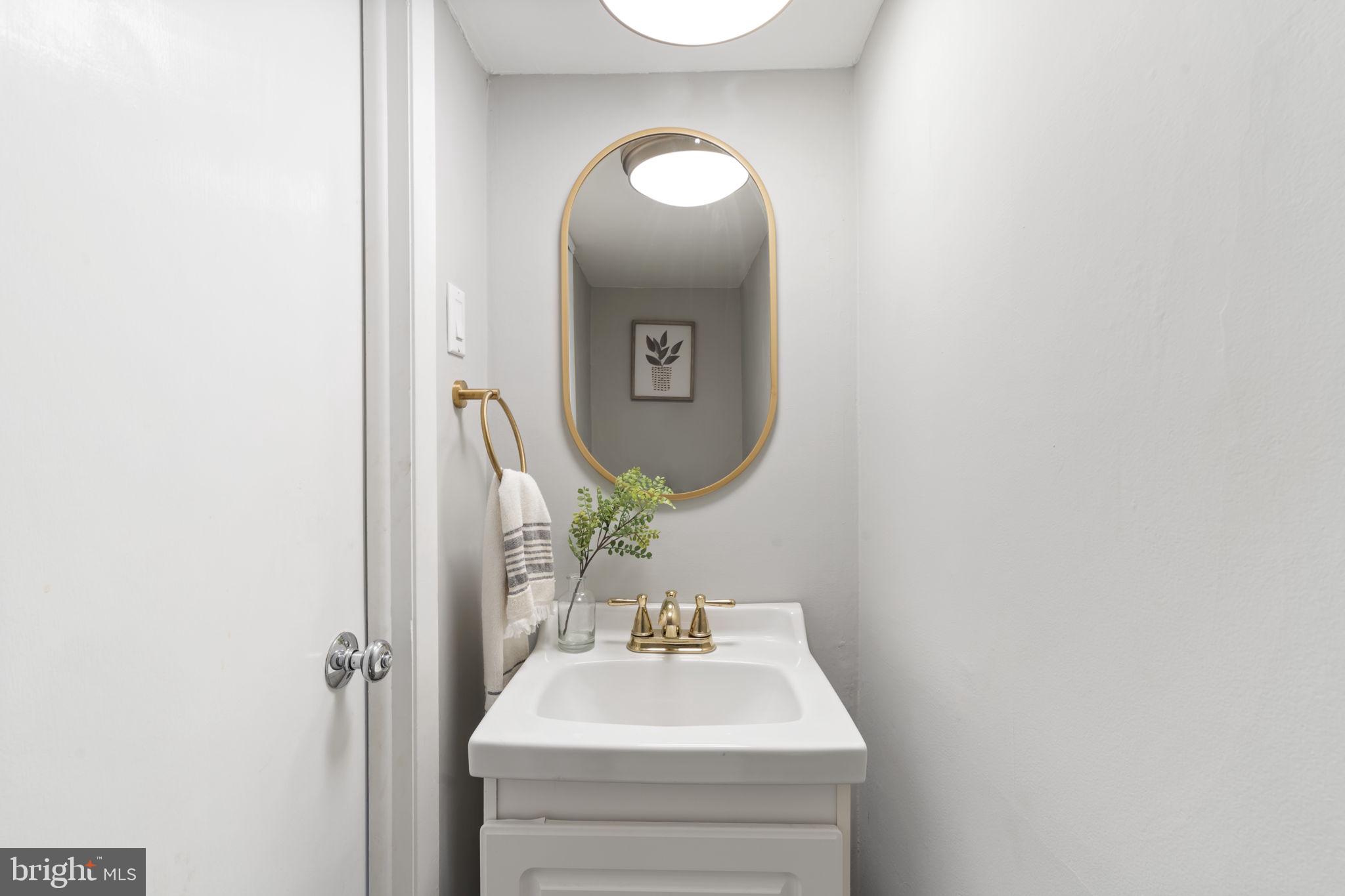 201 Juniper Road Havertown, PA 19083 - Photo 22 of 30 a bathroom with a sink and a mirror