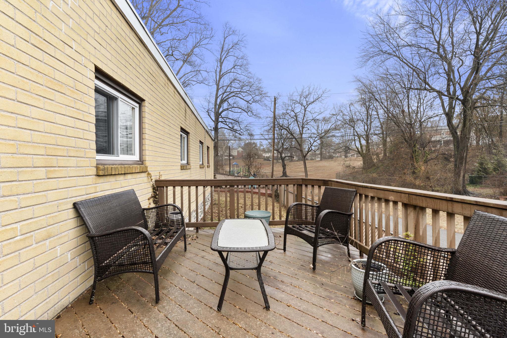 201 Juniper Road Havertown, PA 19083 - Photo 24 of 30 a view of a chairs and table on the deck