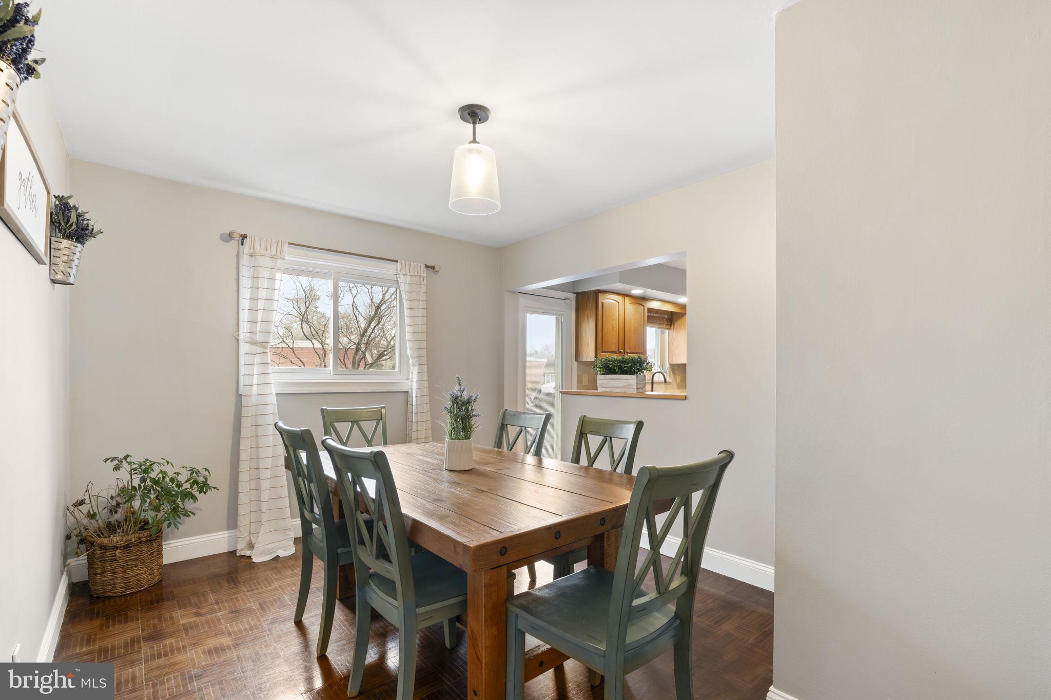 201 Juniper Road Havertown, PA 19083 - Photo 9 of 30 a view of a dining room with furniture and a potted plant