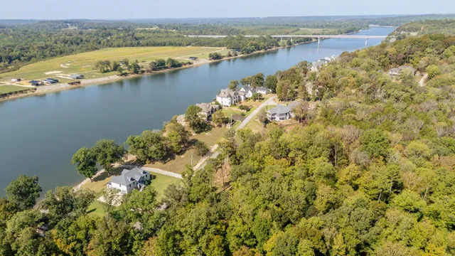 an aerial view of ocean with residential house with outdoor space