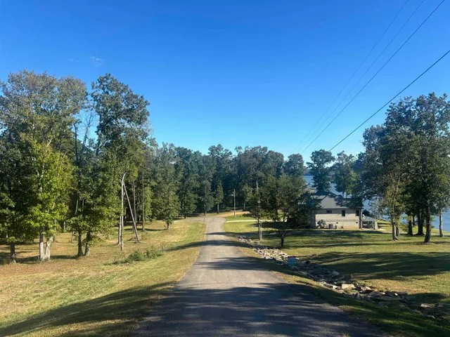 a view of a fountain in front of a house