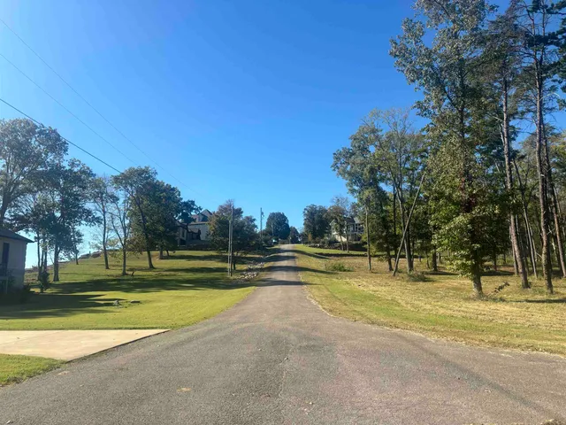 a view of a swimming pool with an outdoor space and seating area