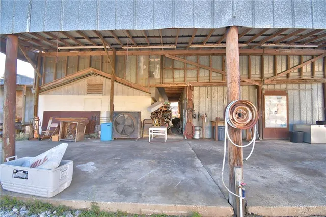 a view of a room with rack and furniture