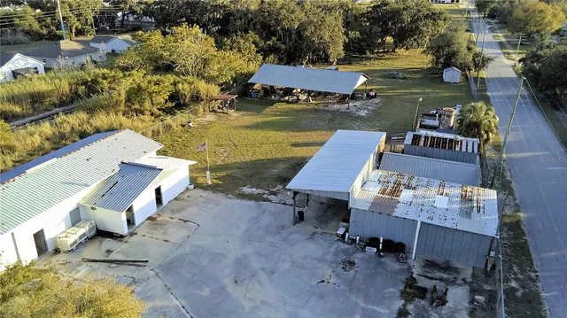an aerial view of a house with outdoor space