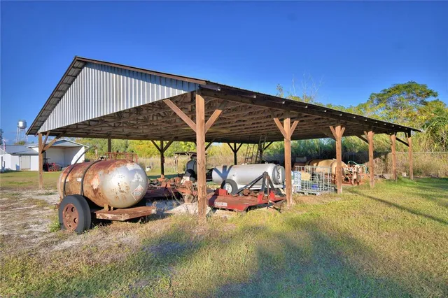 a view of a chairs and table in patio