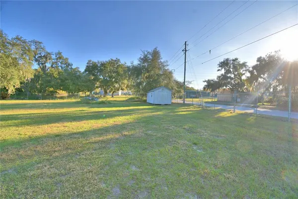 a view of a big yard with an outdoor space