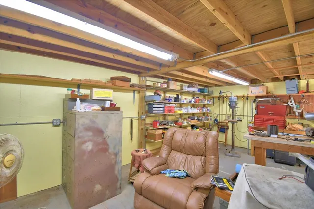 a view of a storage room with water heater and racks