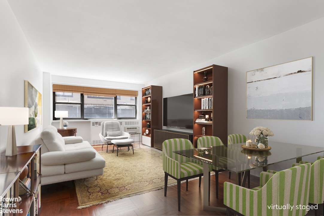 340 East 74th Street, Unit 1J Manhattan, NY 10021 - Photo 1 of 6 a living room with furniture and wooden floor