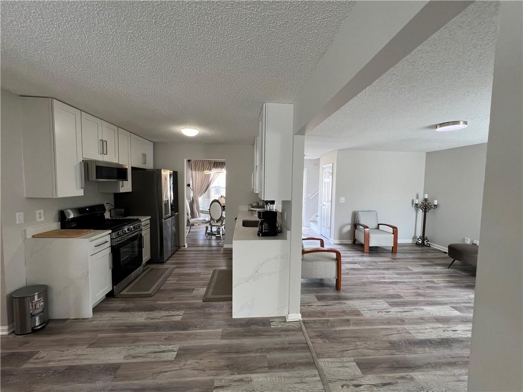 509 Vaughan Valley View Hampton, GA 30228 - Photo 12 of 38 a kitchen with a sink and counter top space