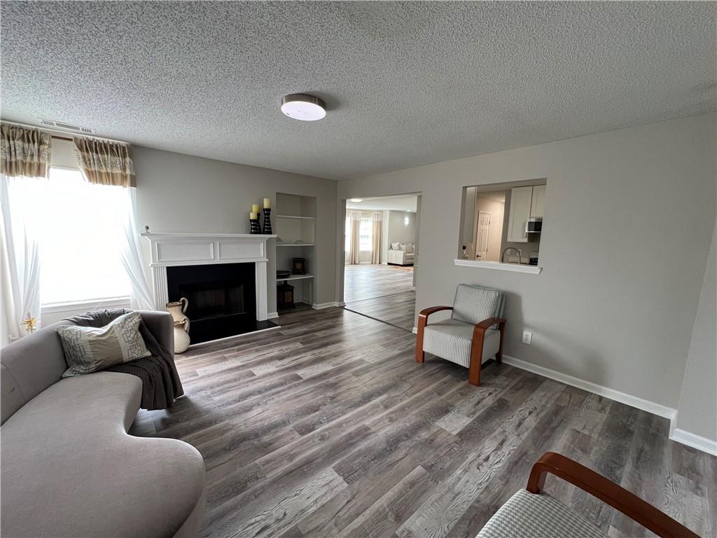 509 Vaughan Valley View Hampton, GA 30228 - Photo 13 of 38 a living room with furniture and a fireplace