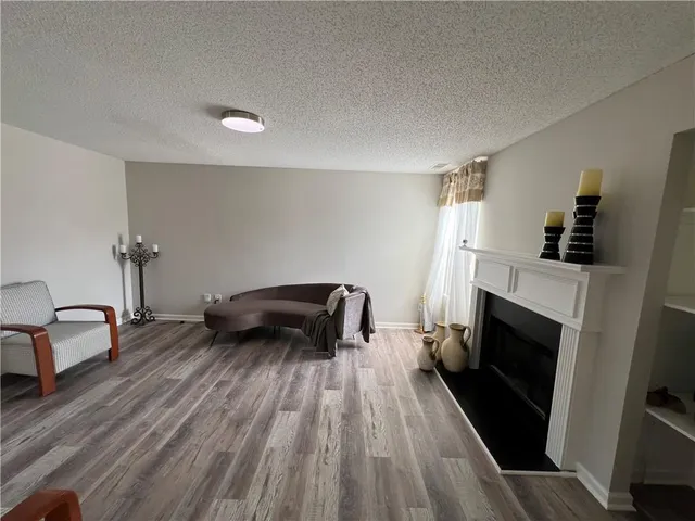 a bedroom with furniture and a fireplace