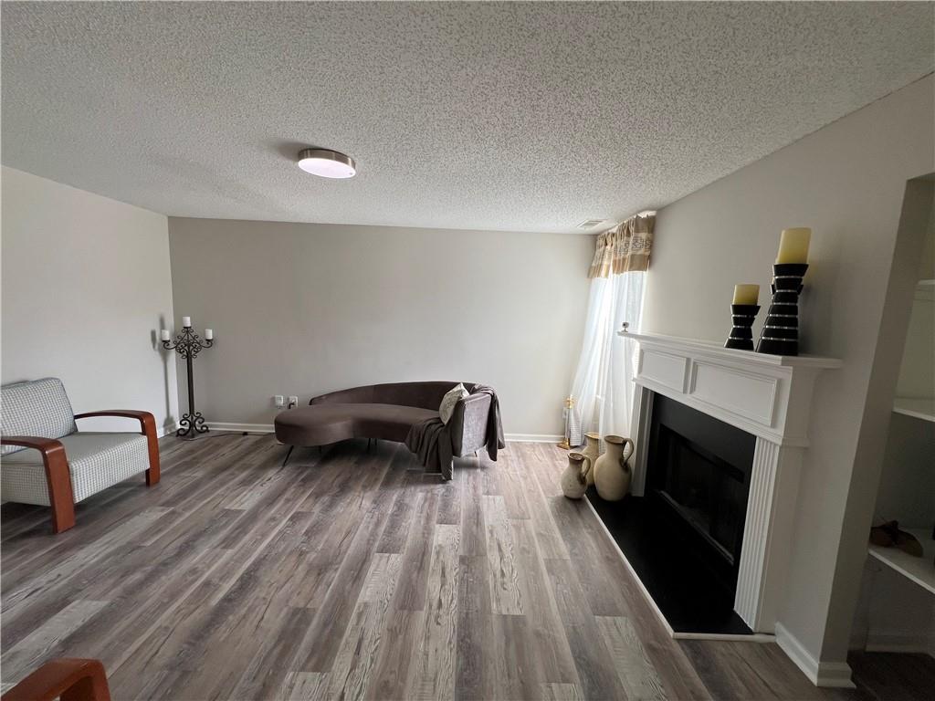 509 Vaughan Valley View Hampton, GA 30228 - Photo 14 of 38 a bedroom with furniture and a fireplace