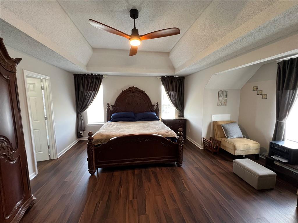 509 Vaughan Valley View Hampton, GA 30228 - Photo 25 of 38 a bedroom with furniture and wooden floor