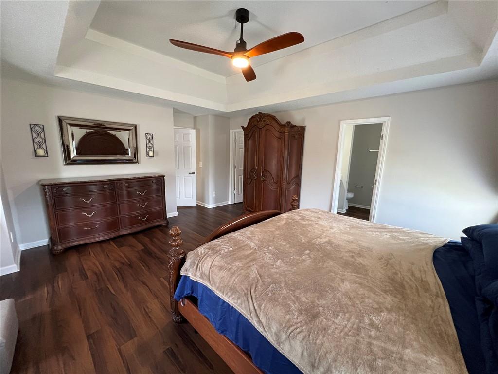 509 Vaughan Valley View Hampton, GA 30228 - Photo 27 of 38 a bedroom with a bed and a flat screen tv